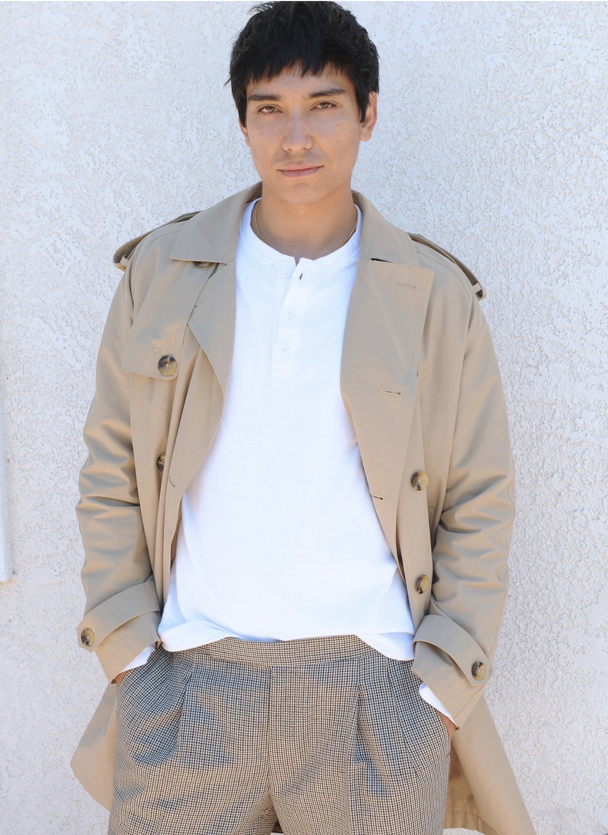 Stern Talent actor in trench coat